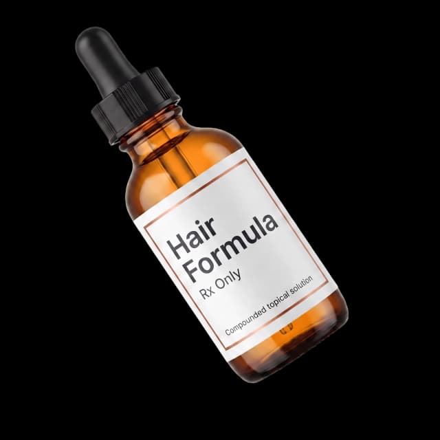 Compounded hair restoration topical solution in a pharmacy-labeled dropper bottle